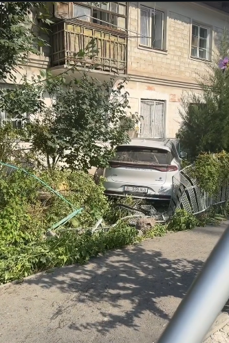 Car rams adjacent area of high-rise building in Bishkek