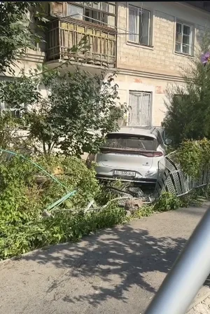 Car rams adjacent area of high-rise building in Bishkek